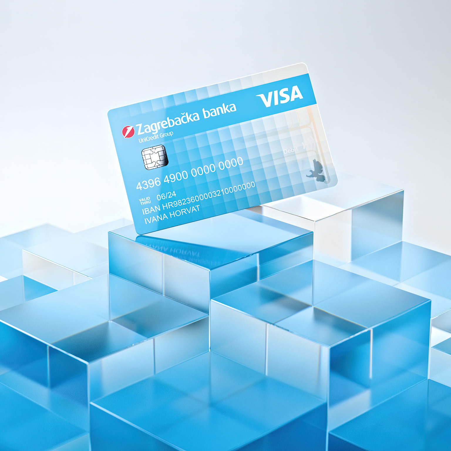 Transparent blue bank debit card floating on blue glass cubes