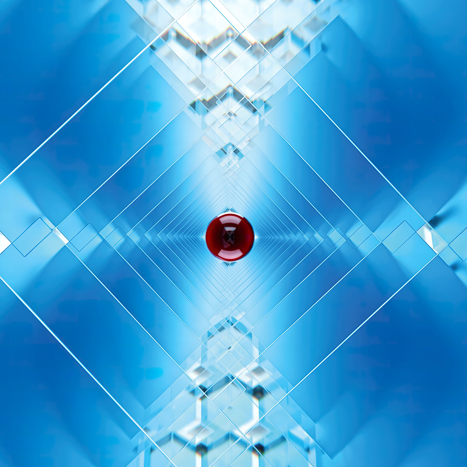 Red glass ball in the middle of kaleidoscope of blue glass panes